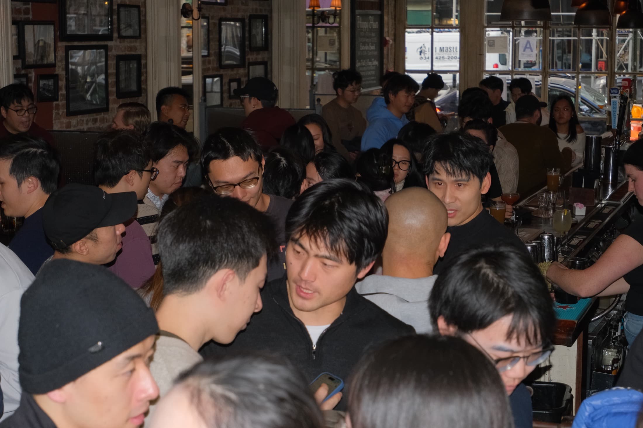 A crowded Solo Unicorn Club room during a founder meetup