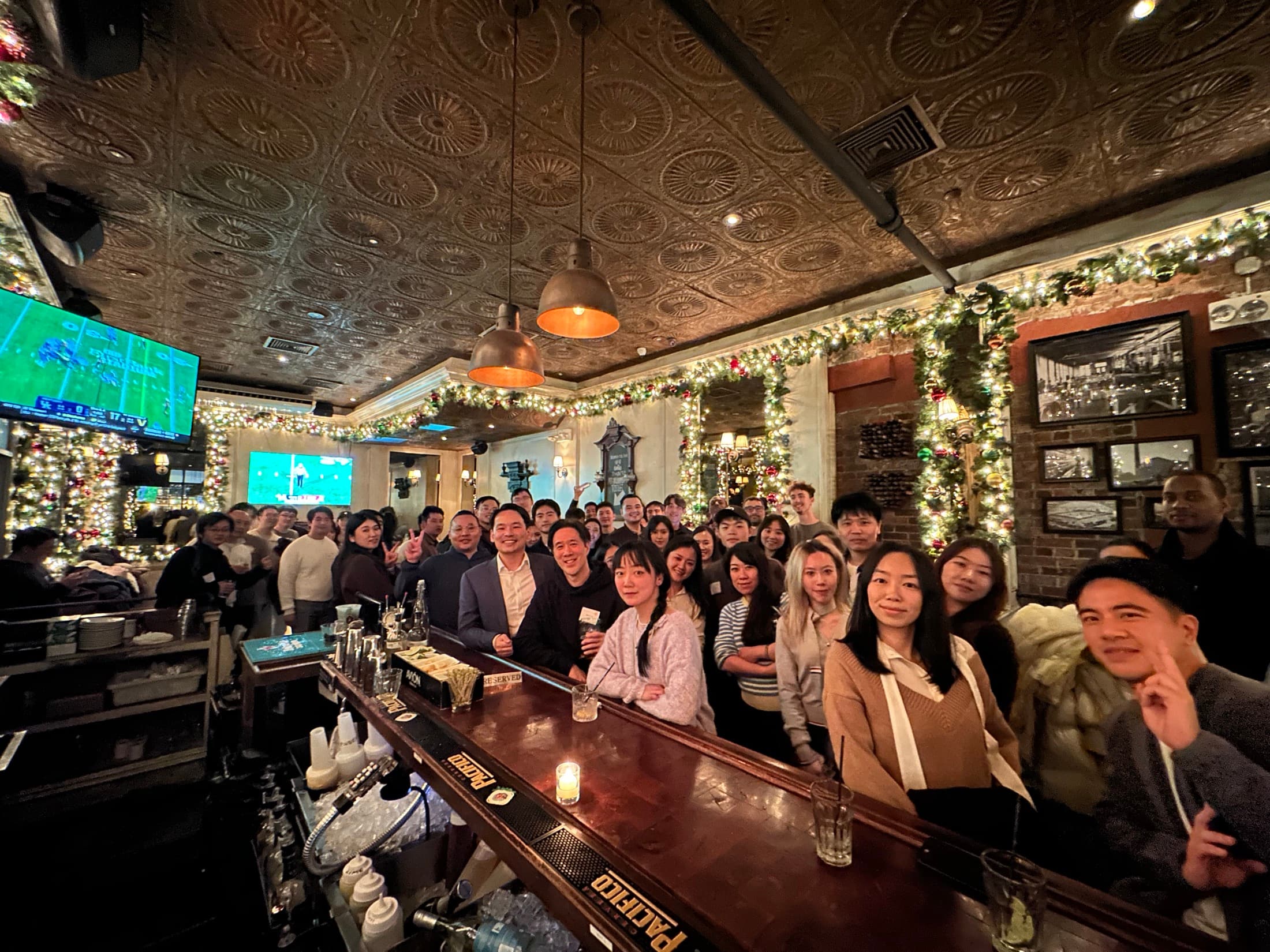 Solo Unicorn Club members gathered around a bar